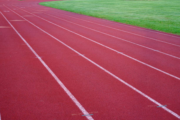 istock red outdoor running track in sport field 2158206582