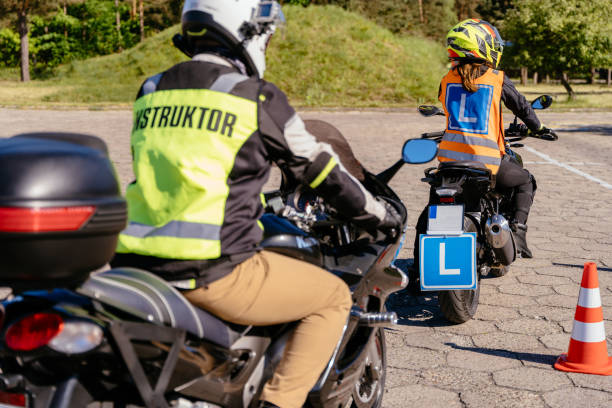 istock A man in a yellow jacket is riding a motorcycle with 2158206679