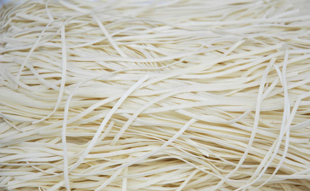 istock close up on raw noodles as food background 2158208351