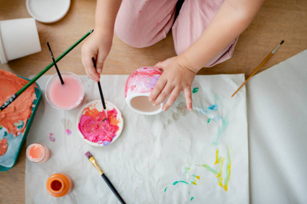istock Kid DIY pot painting hobby at home 2158208605