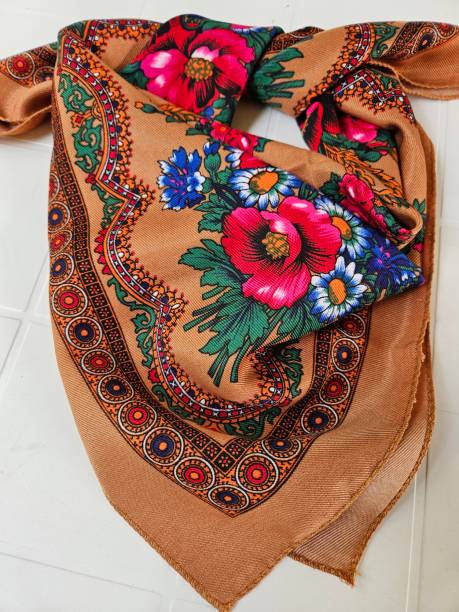 istock Tan Coloured Scarf with Flower Designs 2158212212