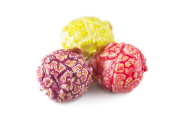 istock Colored fruity popcorn isolated on white background 2158212979