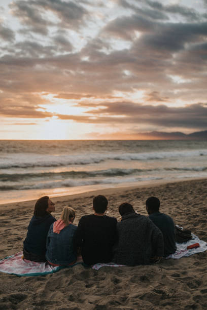 istock Happy friends toasting at the beach 2158213907
