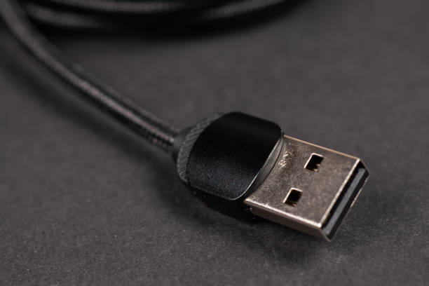 istock Usb cable close up on a black background used to transfer information, hardware connection 2158214023