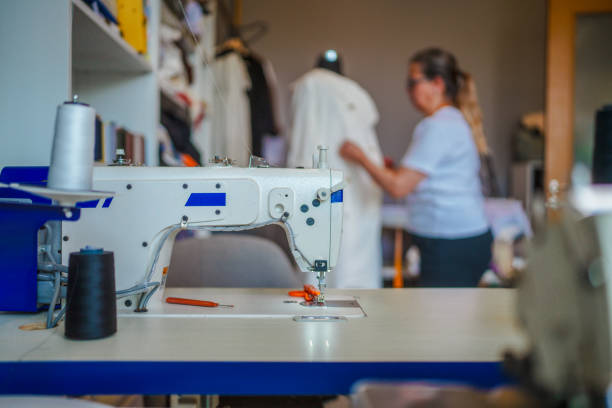 Part of a series of the fashion designer office with tailors, designer and a customer.