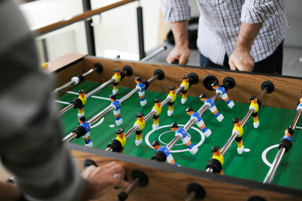 istock People playing table football 2158215059