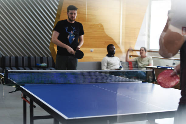 istock Startup Business People Playing Table Tennis Together During Break Time 2158215219
