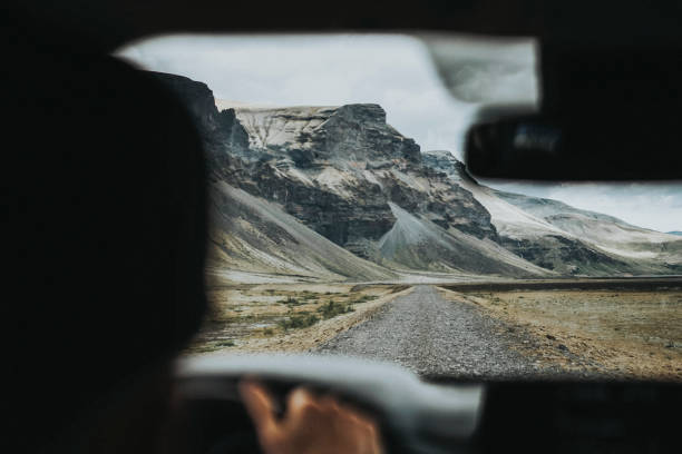 istock Man driving on a dirt road in Iceland 2158215640