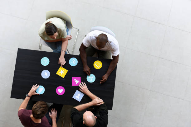 istock Group of diverse people brainstorming together 2158216358