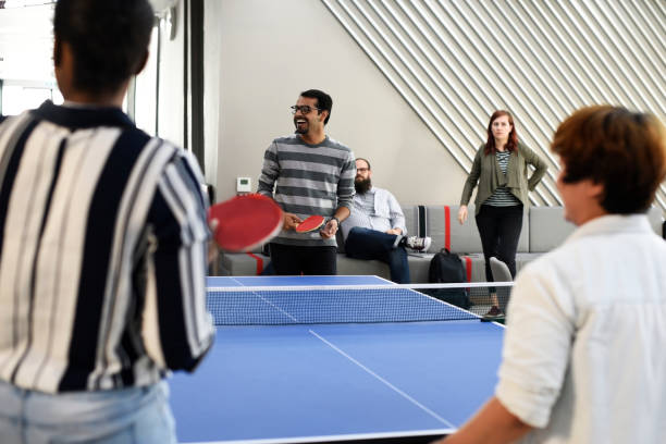 istock Startup Business People Playing Table Tennis Together During Break Time 2158216376