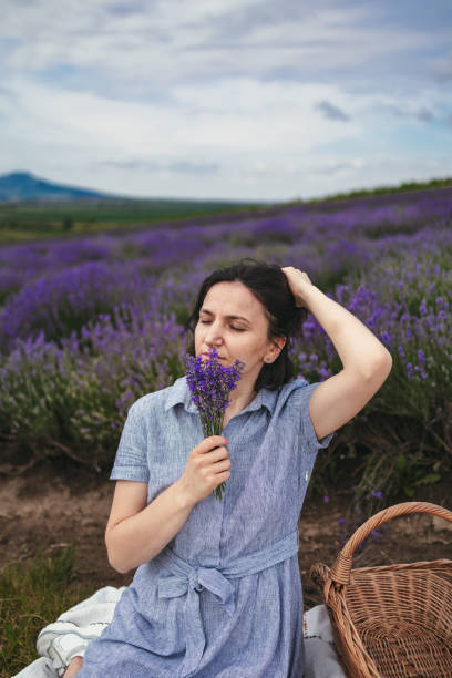 istock Girl rests enjoying in a lavender field 2158216382