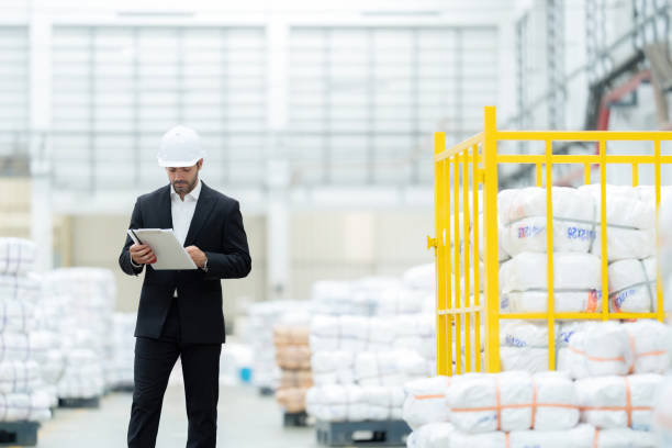 istock American male engineers at European headquarters collaborate on a project that sets new industry standards and practices in a factory exporting the robot and automobile business to the global market. 2158216407