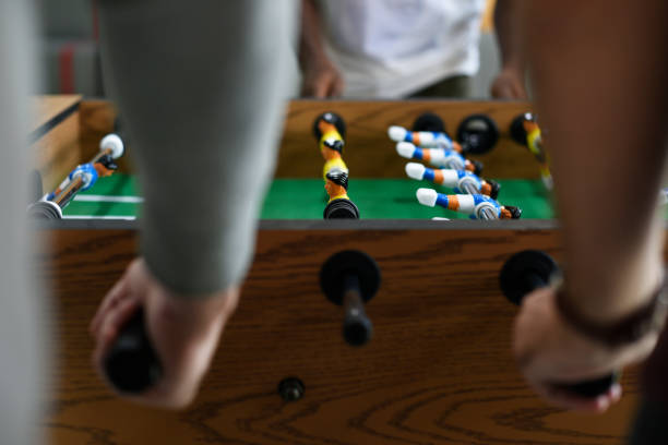 istock People Playing Enjoying Foosball Table Soccer Game Recreation Leisure 2158216709