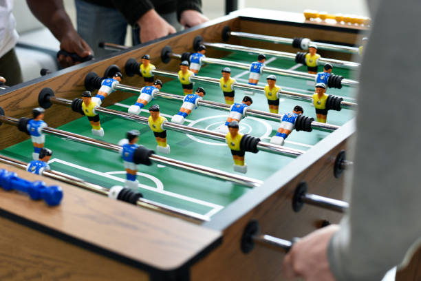 People Playing Enjoying Foosball Table Soccer Game Recreation Leisure