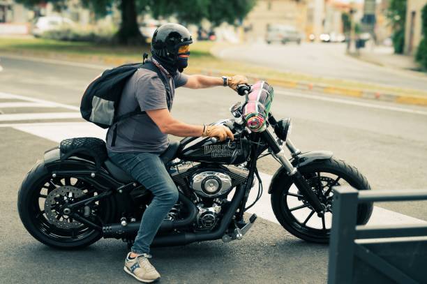 senigallia, Italy – June 09, 2024: A man riding a Harley Davidson motorcycle on a city street