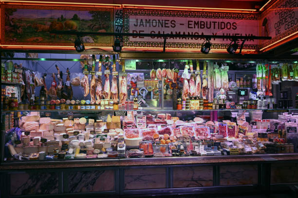 Madrid, Spain, june 8, 2024 : Cheese and meat stall at the Anton Martin market in Madrid