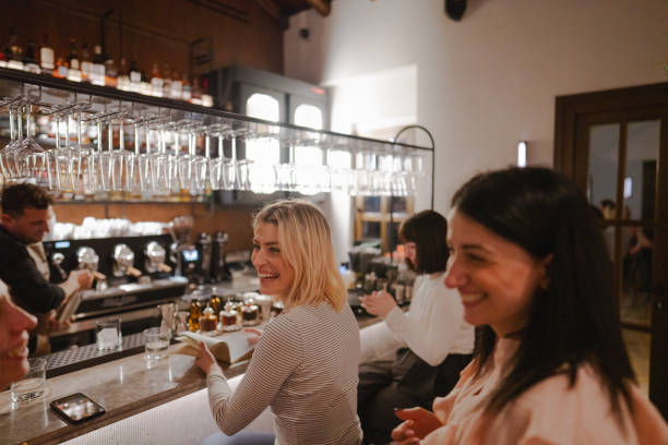 istock Female friends in a bar 2158220218