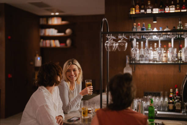 istock Female friends in a bar 2158220661