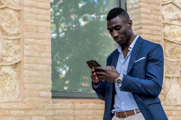 istock African American Businessman with Mobile Phone, Text Area Available 2158221189