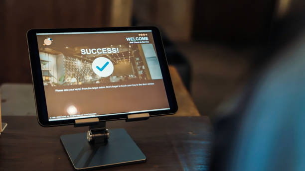 istock A tablet screen displays a successful self check-in at a hostel, highlighting the convenience of digital check-in services. 2158222894