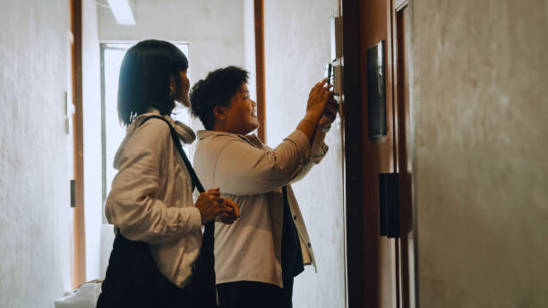 istock LGBT Couple using smart phone open and unlock a hostel door 2158222918