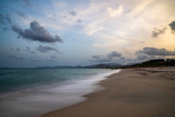Long photographic exposure on the shoreline of Capo Ferrato in Sardinia