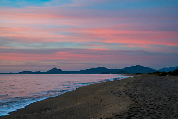Romantic sky at dawn in Porto Corallo in Sardinia