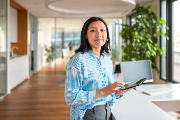 istock Asian Businesswoman with Digital Tablet in Modern Office 2158225516
