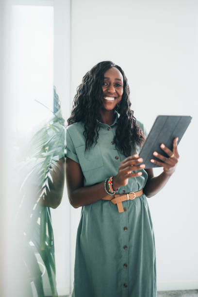 istock Professional Black Businesswoman with Tablet in Office 2158225547