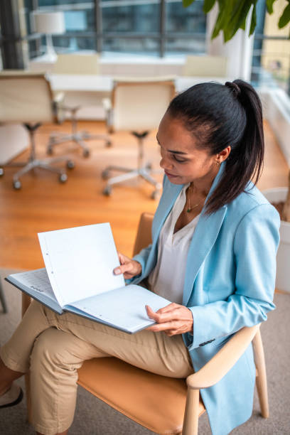 istock Hispanic Businesswoman Engaging in Office Work 2158225573