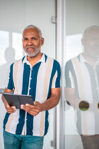 istock Professional Hispanic Businessman with Digital Tablet in Office Setting 2158225586