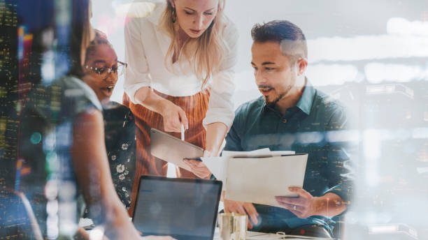 business people working with a digital tablet in a meeting - união - fotografias e filmes do acervo
