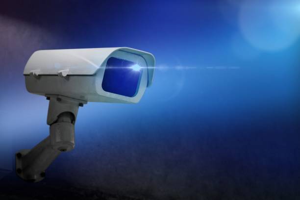 istock Closeup of CCTV camera on the wall 2158226044