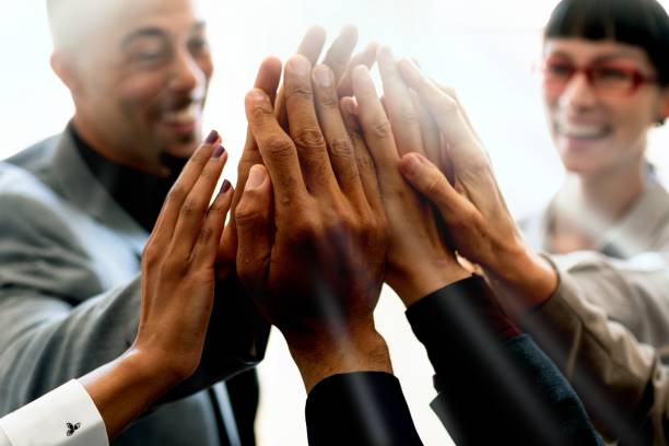 istock Cheerful business people doing a high five 2158226422