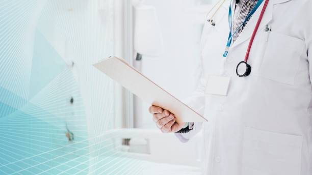 istock Doctor reading a coronavirus patient medical chart 2158227193