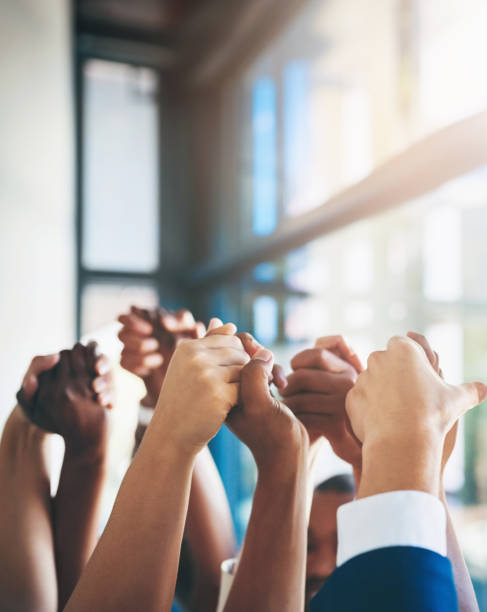 istock Business people, holding hands and group unity with support for team building, solidarity or collaboration. Partnership, fingers and corporate trust for staff union or colleagues, goal or agreement 2158230115