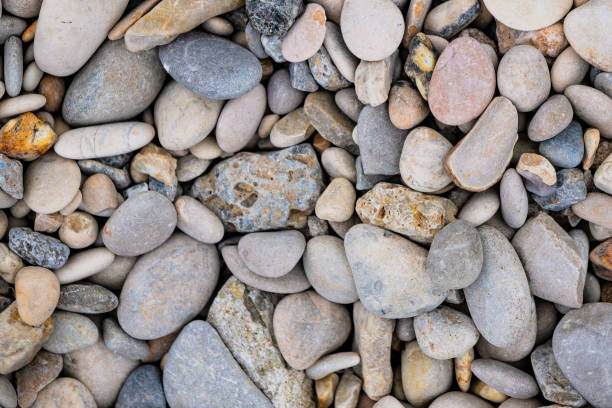 istock pattern of sea stones on the beach 2158230400
