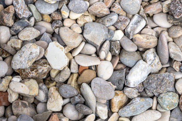istock pattern of sea stones on the beach 2158230401