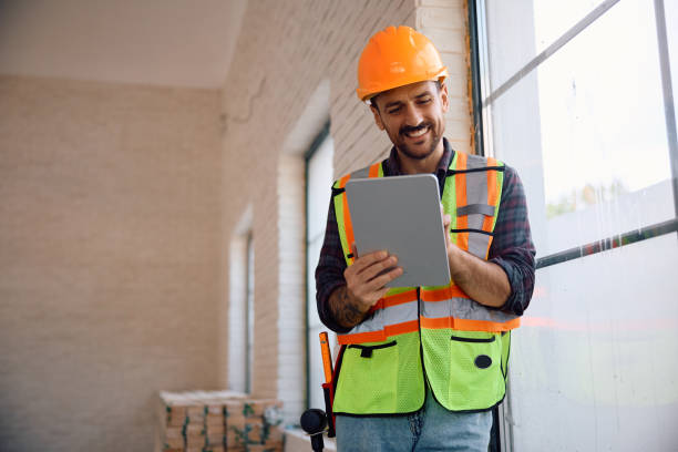 istock Happy foreman using digital tablet at renovating home. 2158230650