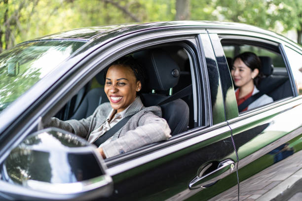 istock Two business woman driving in a car 2158233190