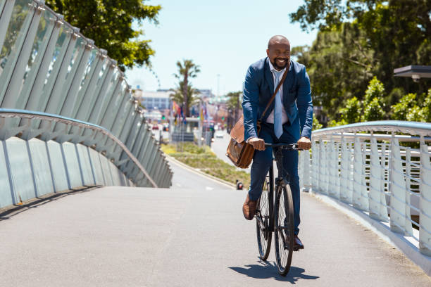 istock Man cycling to work on a beautiful summer day 2158233784