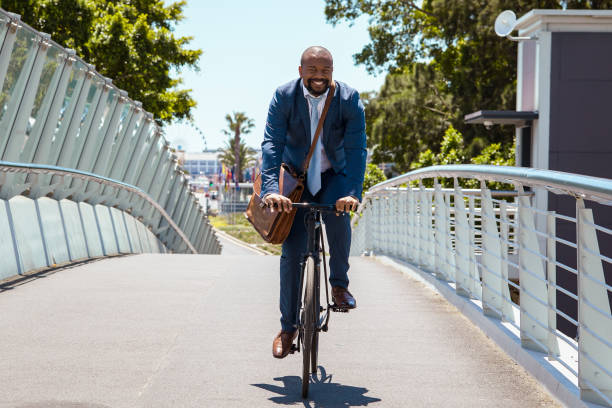 istock Man cycling to work on a beautiful summer day 2158233794