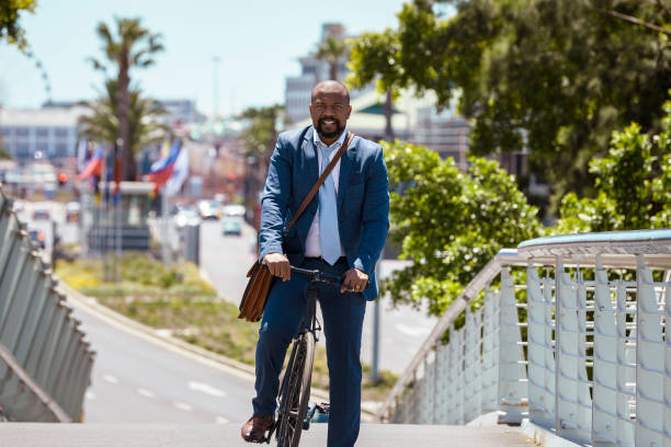 istock Man cycling to work on a beautiful summer day 2158233808