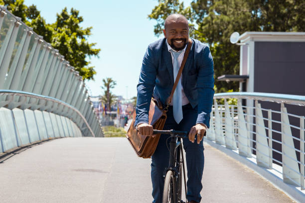 istock Man cycling to work on a beautiful summer day 2158233809