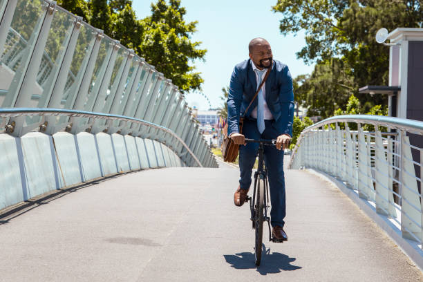 istock Man cycling to work on a beautiful summer day 2158233810