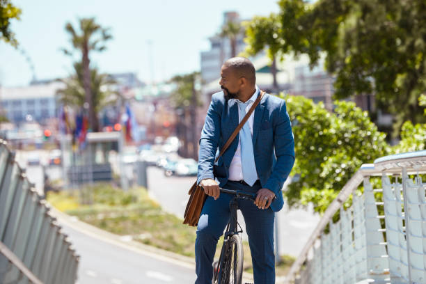 istock Man cycling to work on a beautiful summer day 2158233816