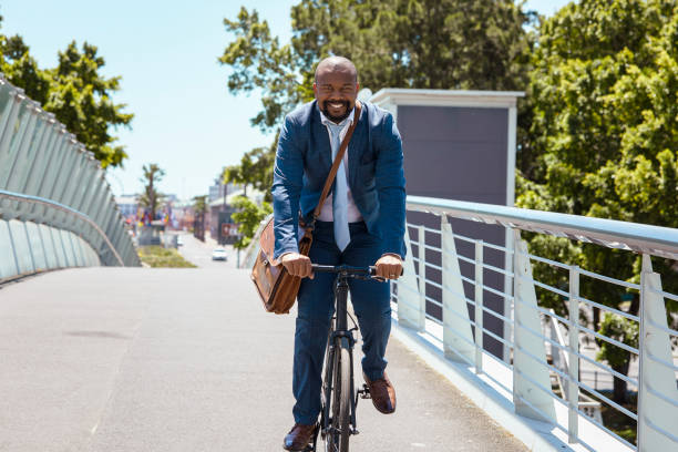 istock Man cycling to work on a beautiful summer day 2158233831
