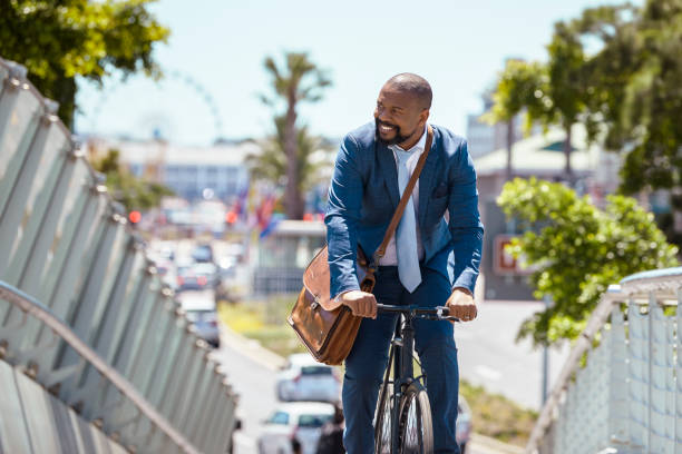 istock Man cycling to work on a beautiful summer day 2158233834