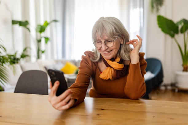 istock Senior Woman on Video Call at Home 2158233862