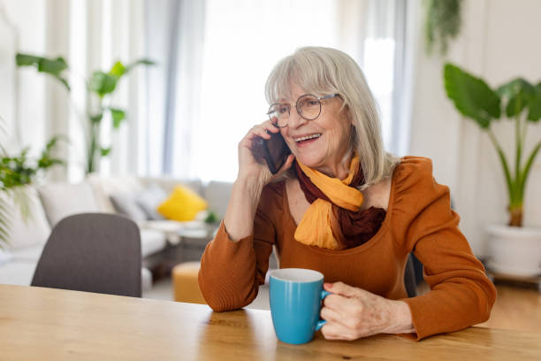 istock Senior Woman talking on mobile phone 2158234245